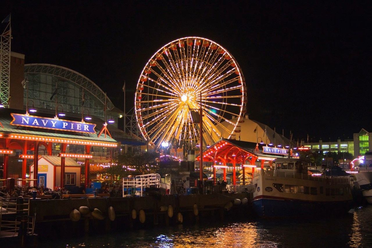 Low angle view of illuminated ferris wheel at navy pier