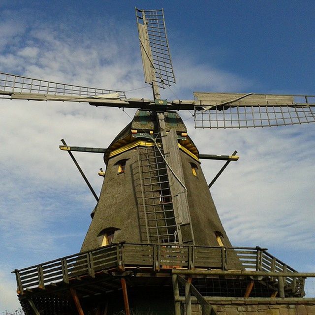 LOW ANGLE VIEW OF TRADITIONAL WINDMILL AGAINST SKY