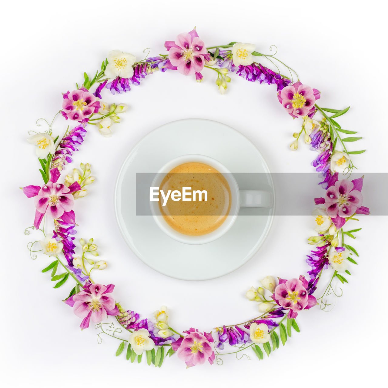 Directly above shot of coffee cup in flowers frame