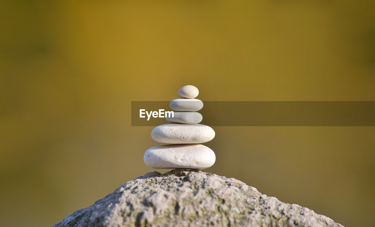 CLOSE-UP OF STACK OF STONES