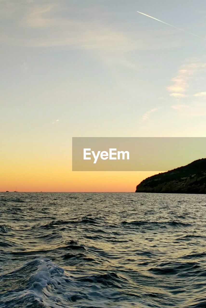 Scenic view of sea against sky during sunset