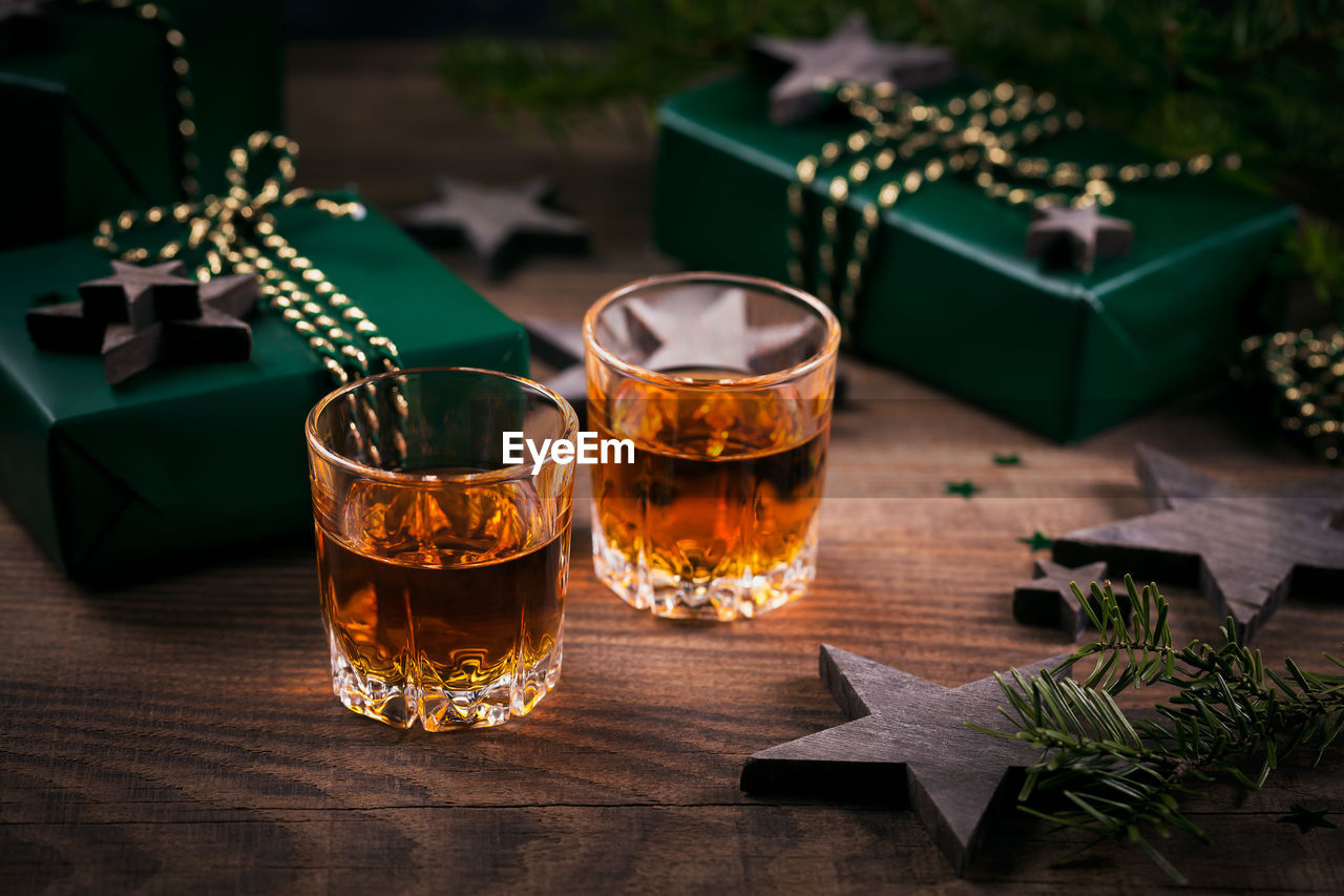 Whiskey, brandy or liquor shot and christmas decorations