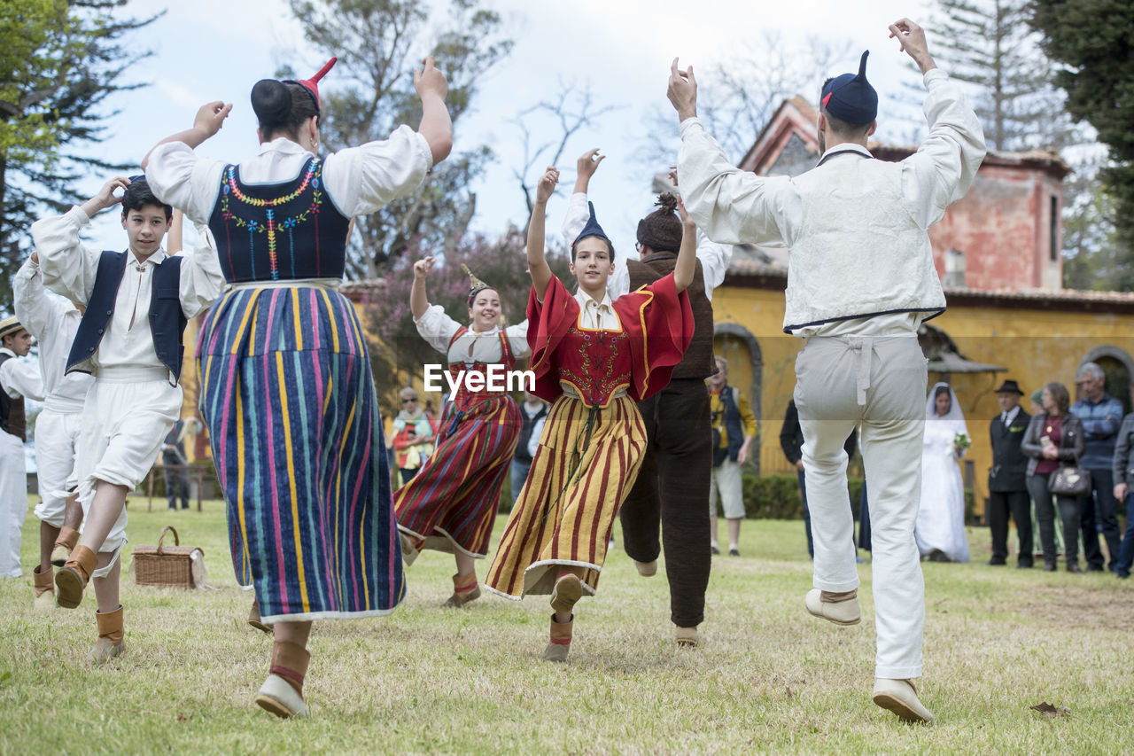 GROUP OF PEOPLE ON TRADITIONAL CLOTHING