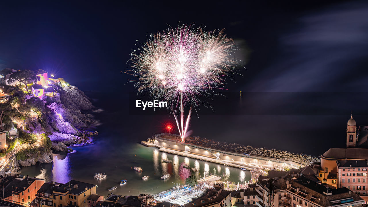 Low angle view of firework display at night. italy