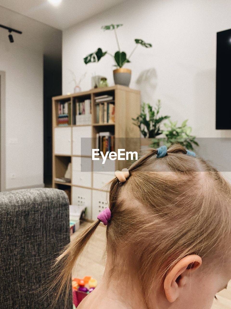 indoors, one person, headshot, lifestyles, adult, women, domestic room, home interior, portrait, domestic life, hairstyle, plant, relaxation, furniture, living room, blond hair, female, bun, child, hairdresser, human hair, childhood, leisure activity, nature