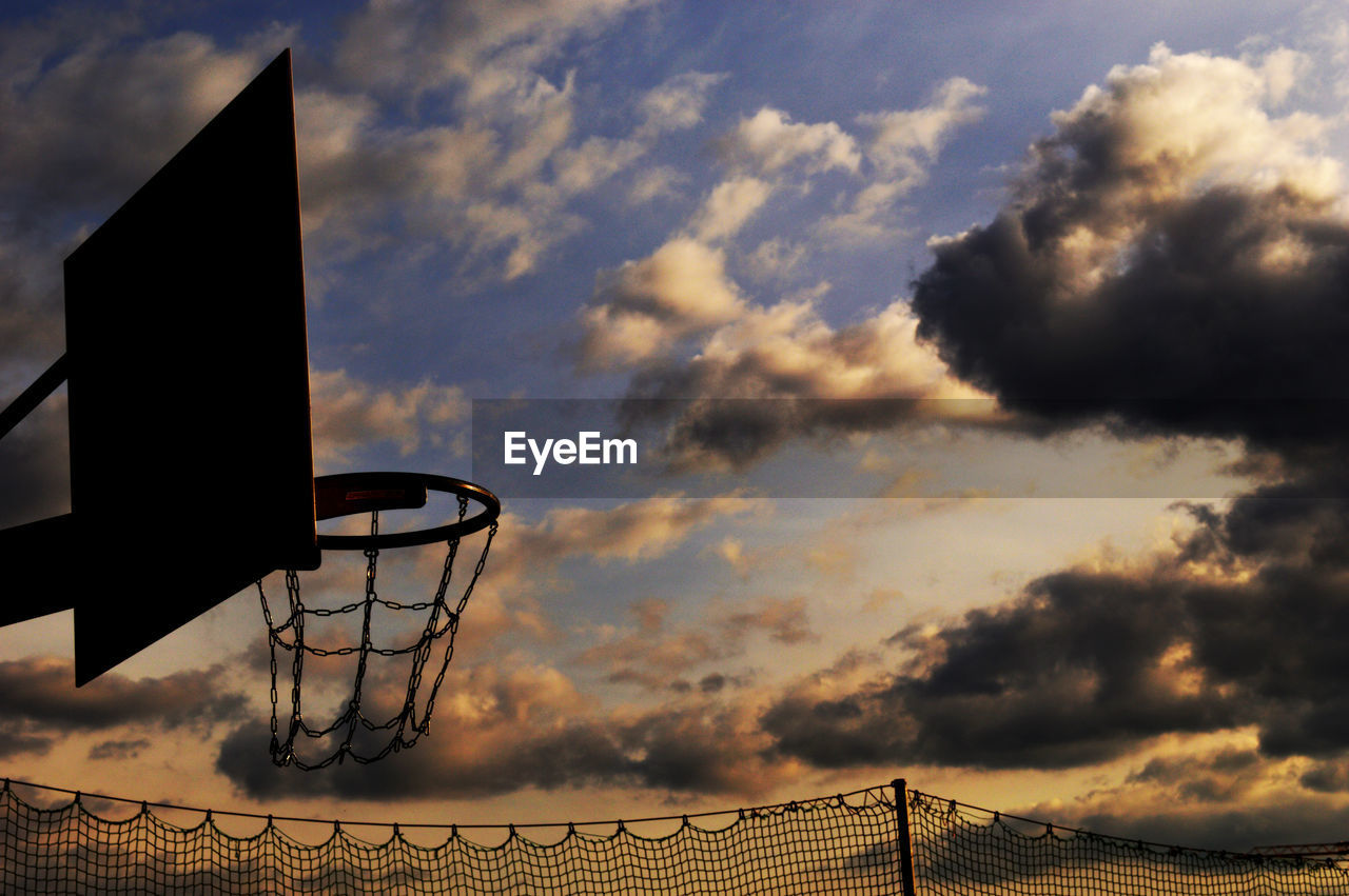 Low angle view of silhouette basketball hoop against sky during sunset