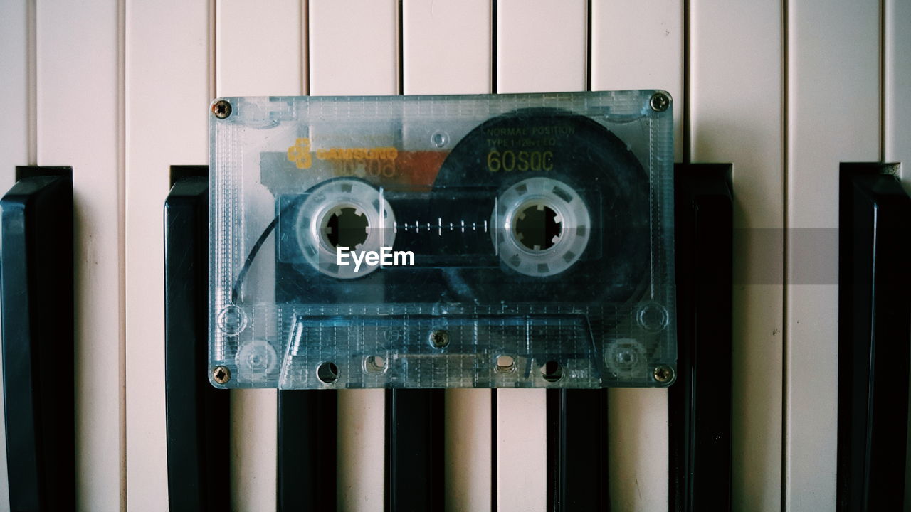 Close-up of audio cassette on piano