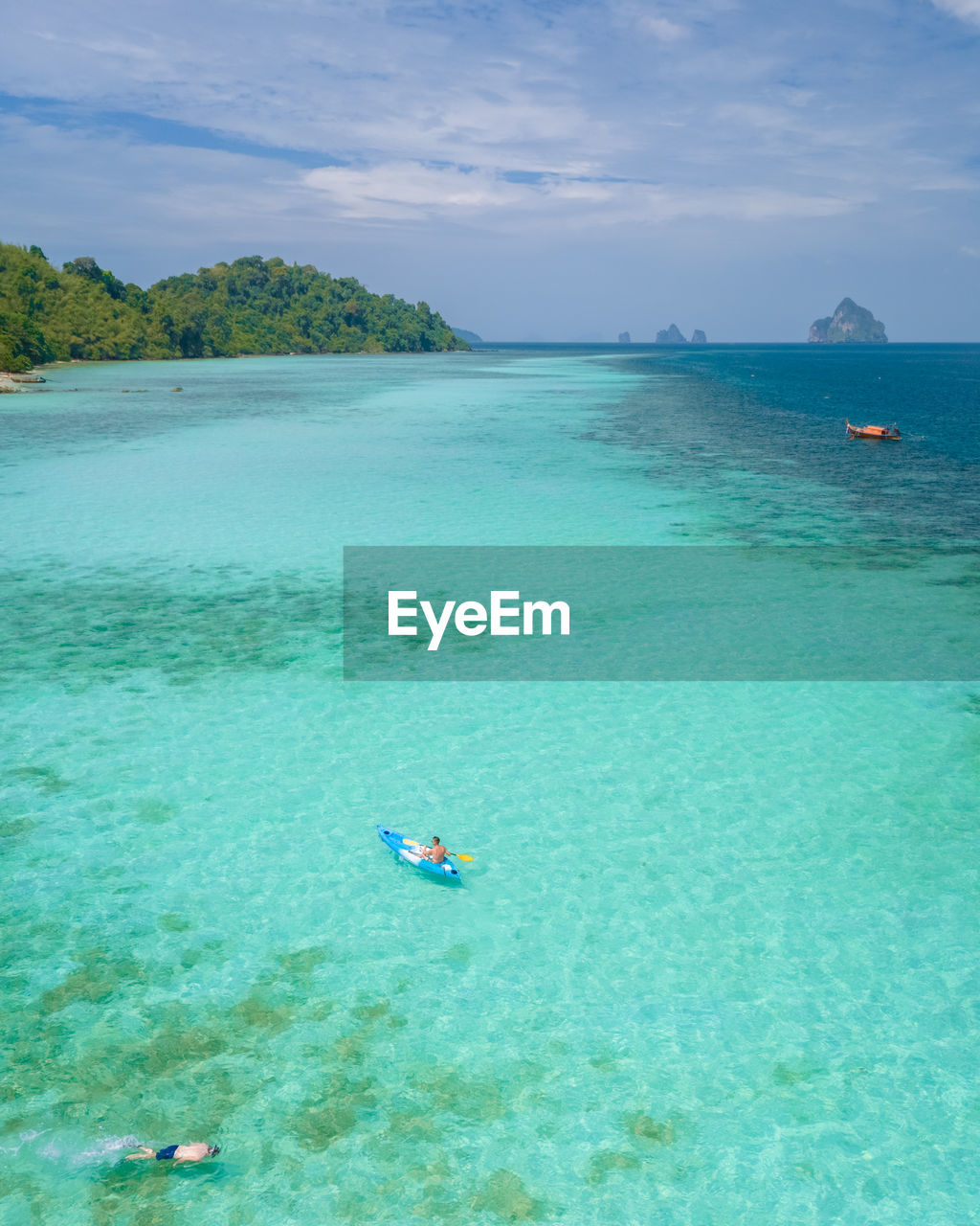 people swimming in sea