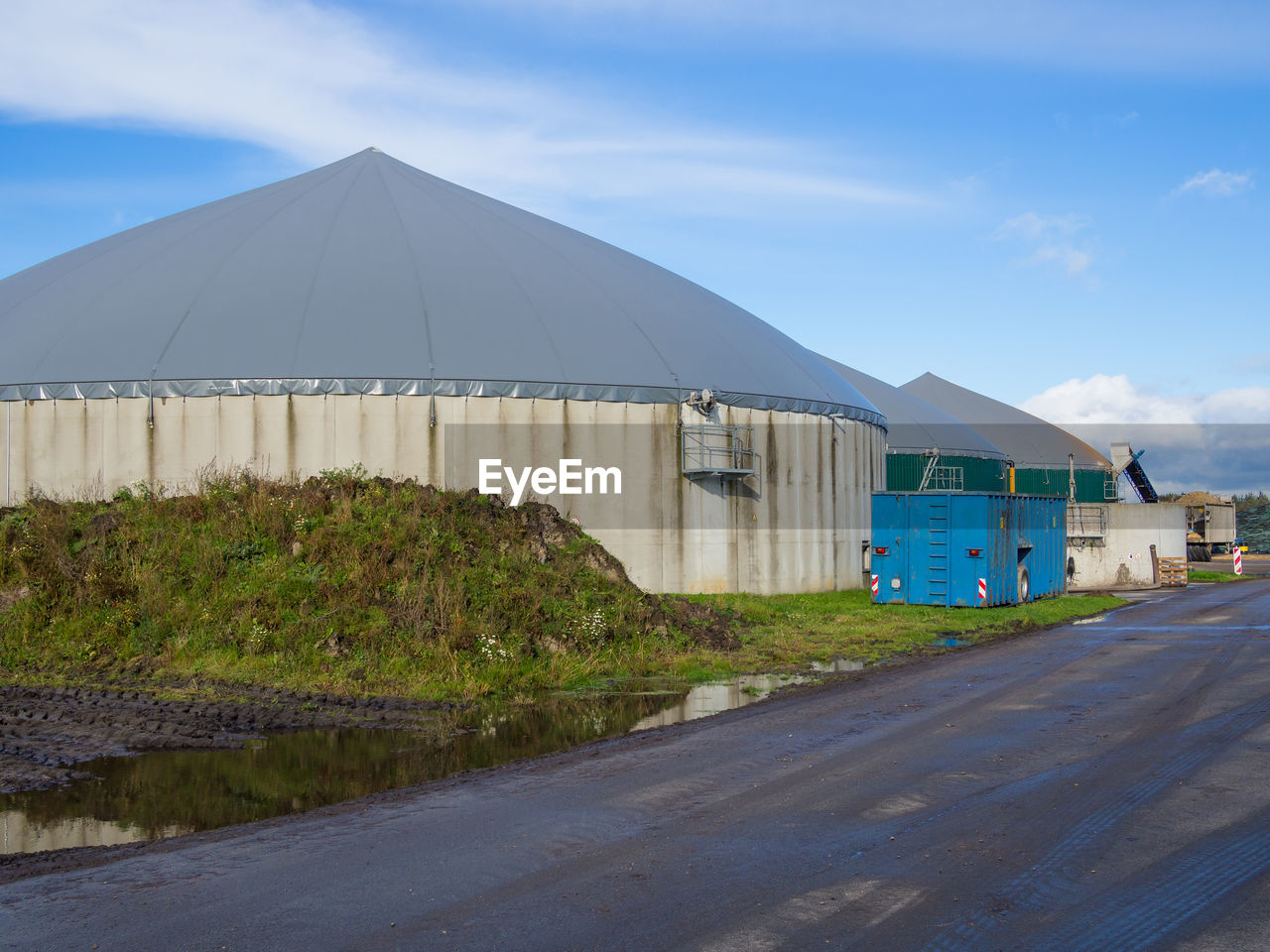 Biogas energy power plant against clear sky in germany