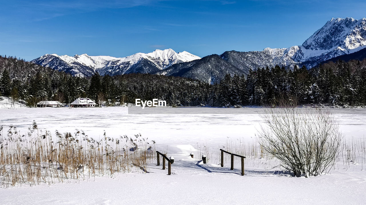 Bridge on a frozen lake, wintertime at mittenwald, lautersee, bavaria