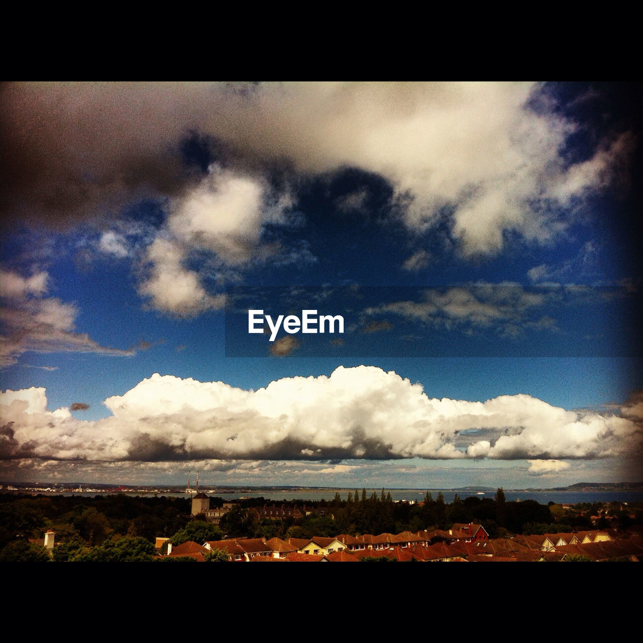 SCENIC VIEW OF MOUNTAINS AGAINST CLOUDY SKY