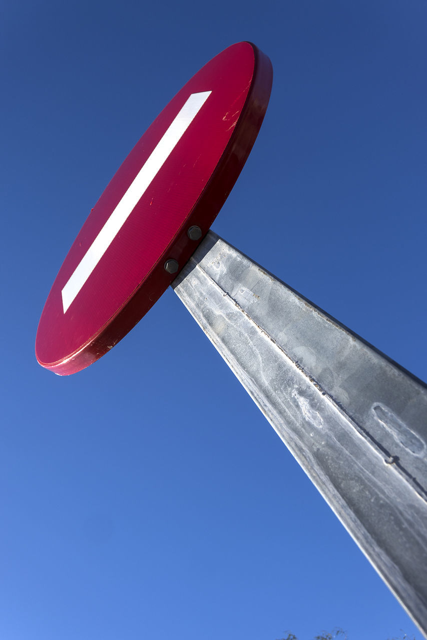 Low angle view of do not enter sign against clear blue sky