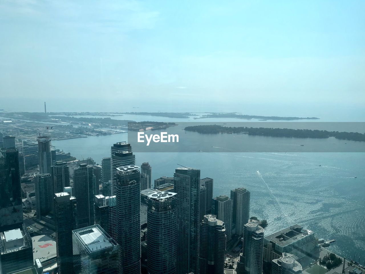 HIGH ANGLE VIEW OF CITY AND BUILDINGS AGAINST SKY