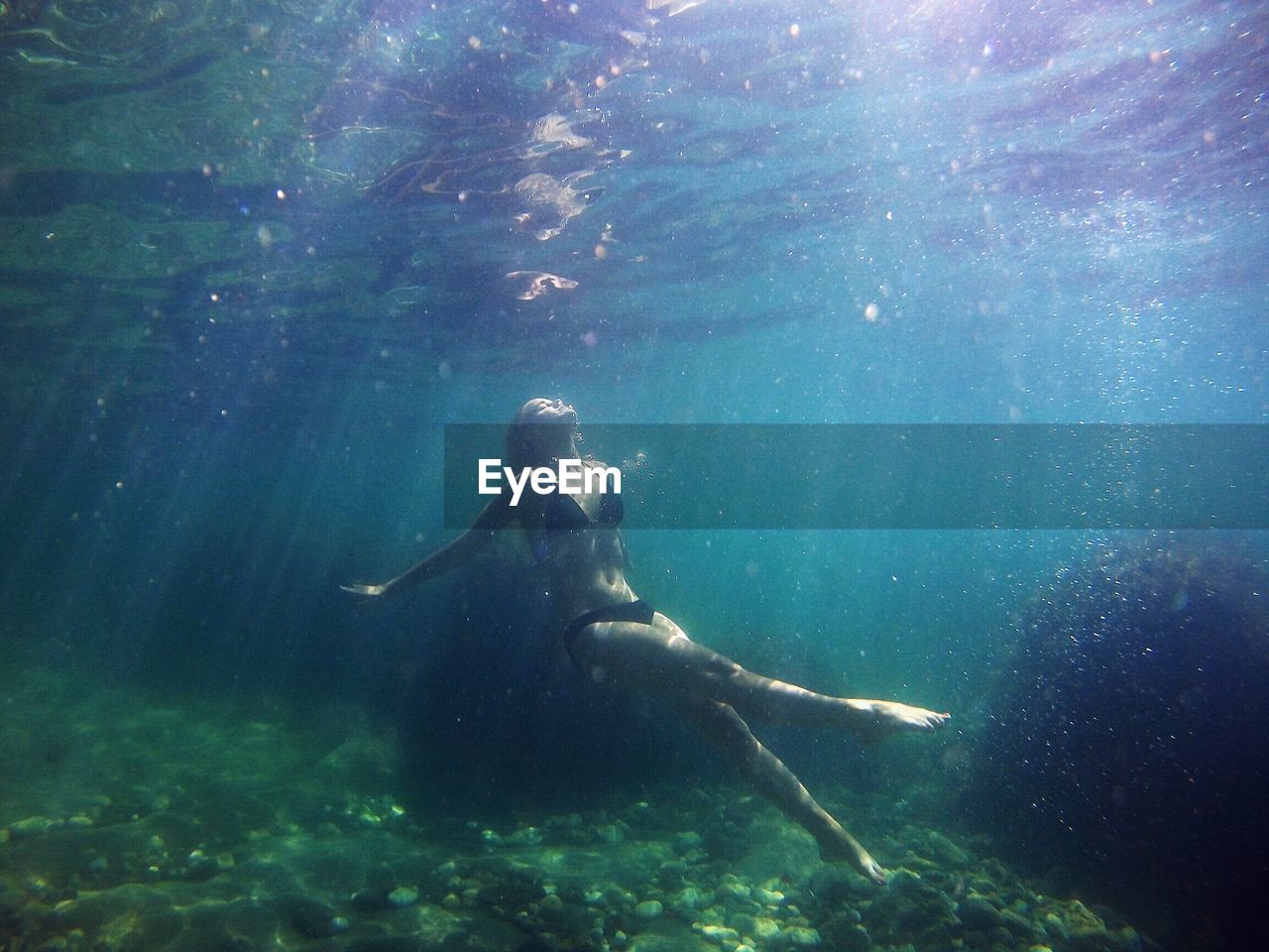 Woman swimming in sea