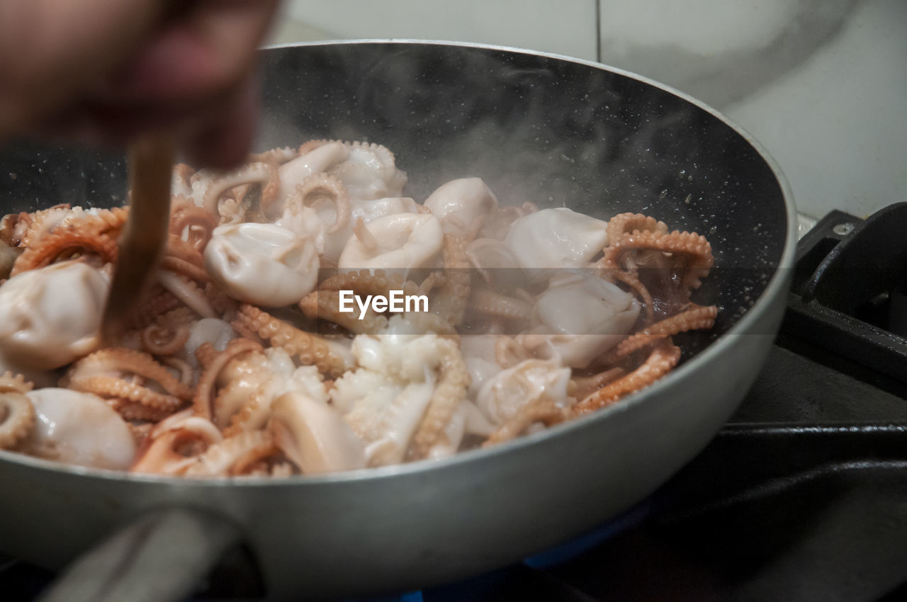 Cooking octopus in a pan close up