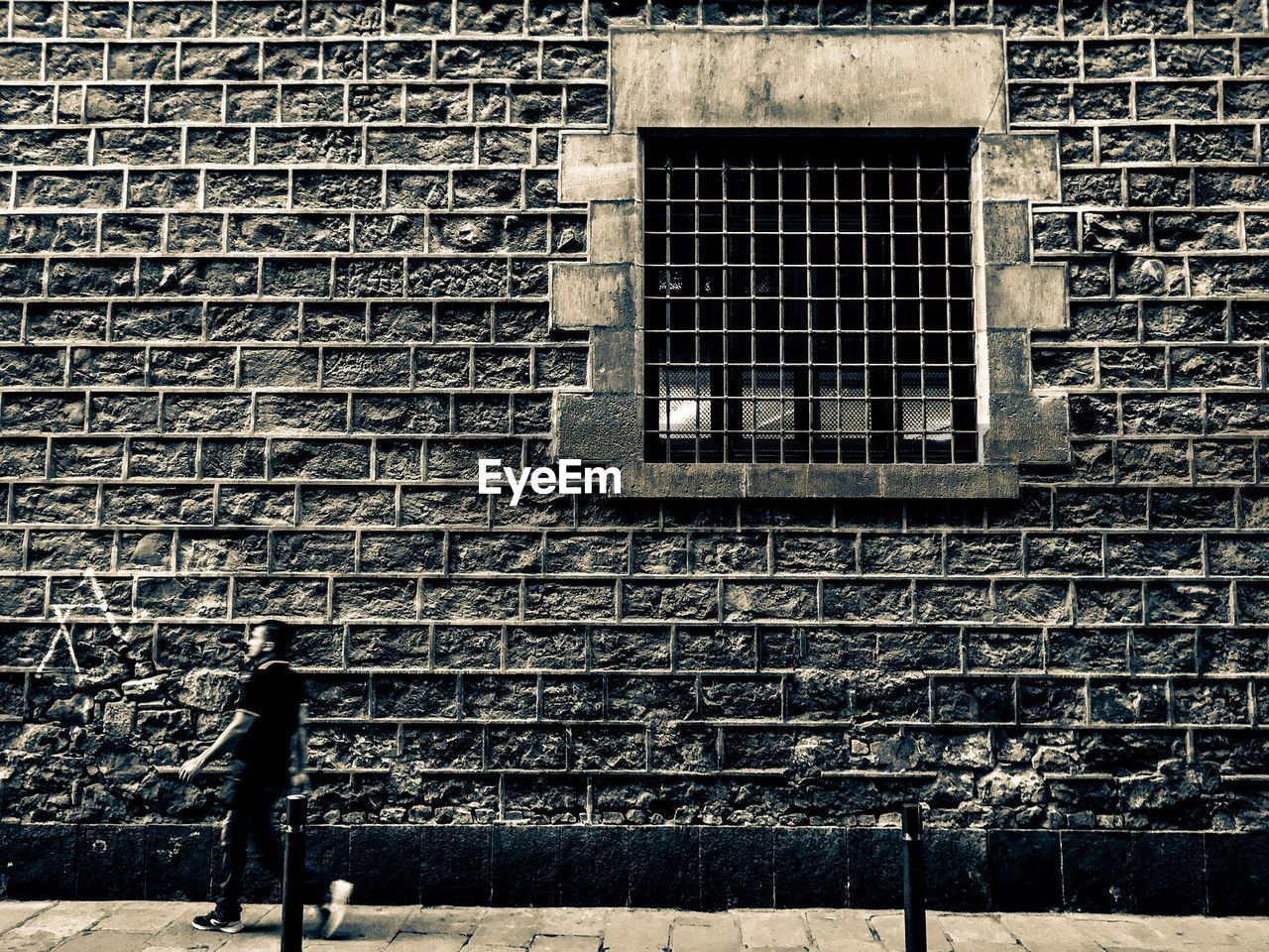 MAN STANDING ON WINDOW