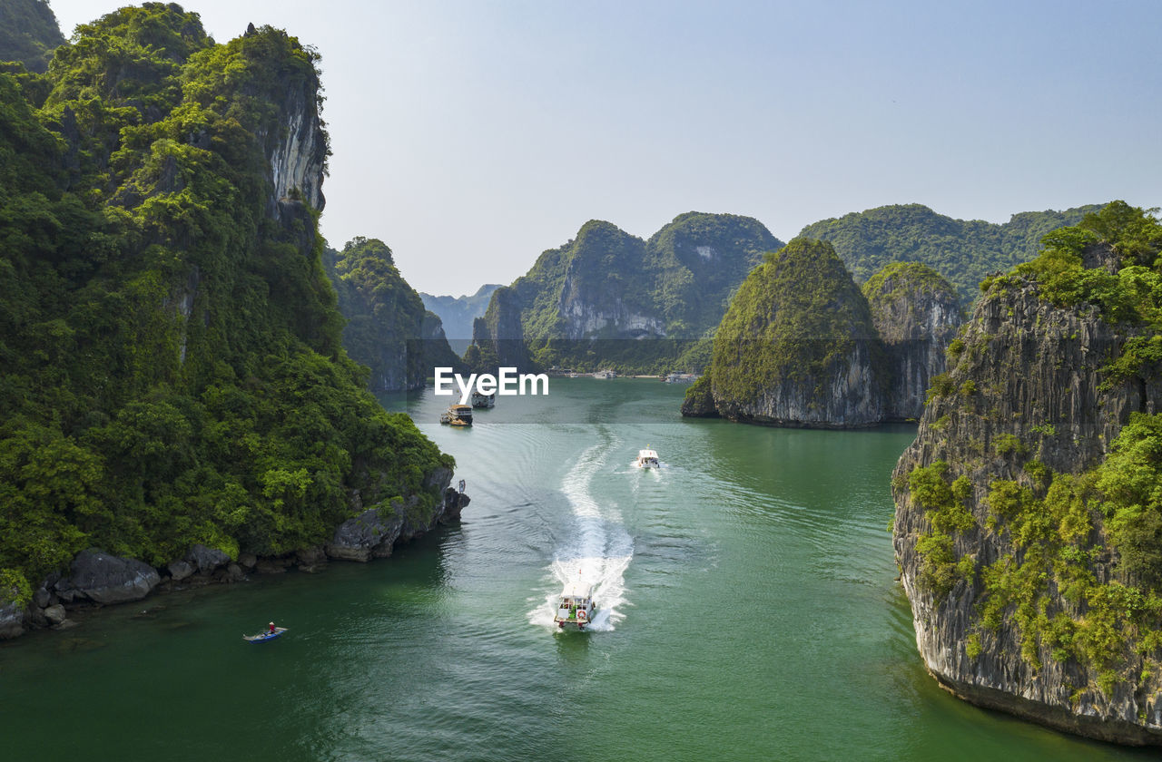 SCENIC VIEW OF SEA AND ROCKS AGAINST SKY