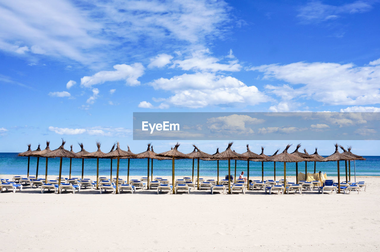 Scenic view of beach against sky, lonely person on dumbed on quarantine 