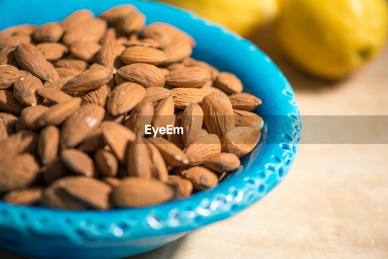 CLOSE-UP OF ROASTED COFFEE BEANS IN BOWL