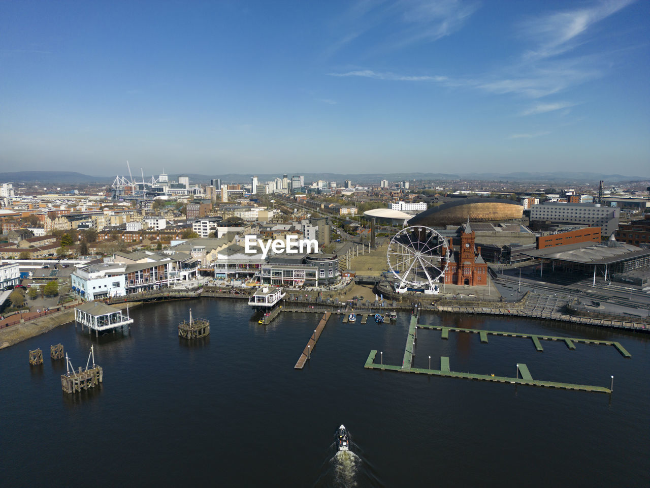 high angle view of city by sea against sky