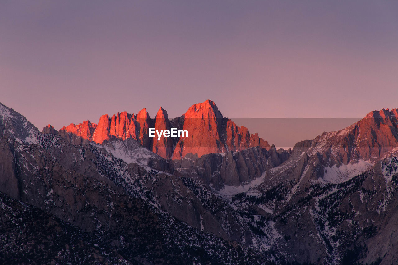 Scenic view of mountains against sky during sunrise