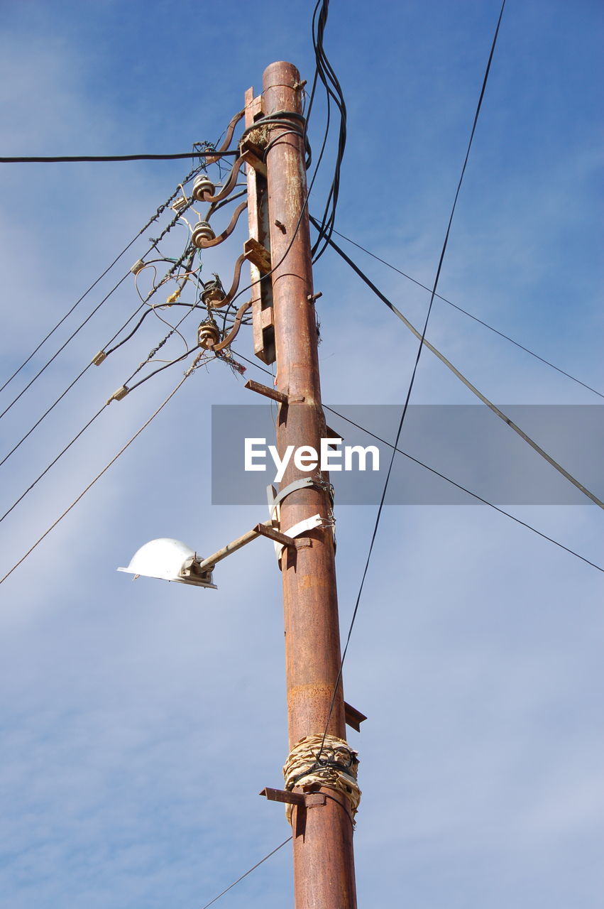 LOW ANGLE VIEW OF POWER LINES AGAINST SKY