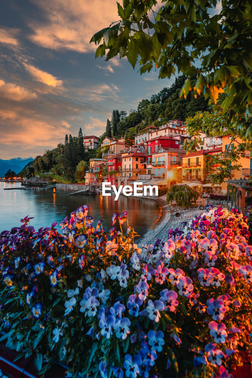 Village of varenna on lake como at sunset with illuminated houses