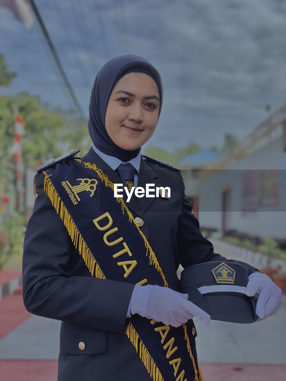 Beautiful woman in uniform in open space