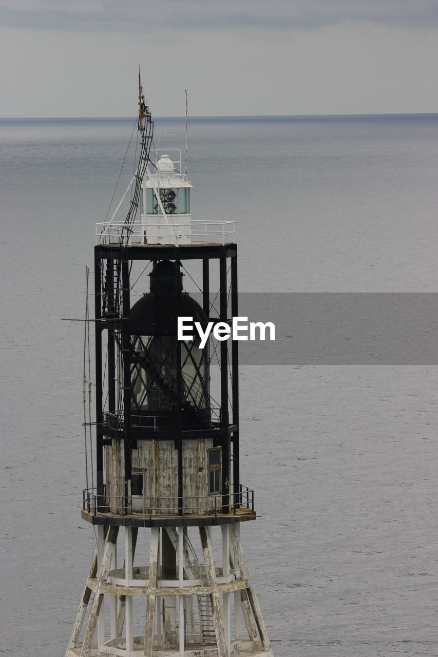 CRANE AGAINST SEA