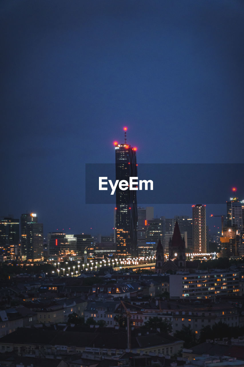 Illuminated buildings in city at night