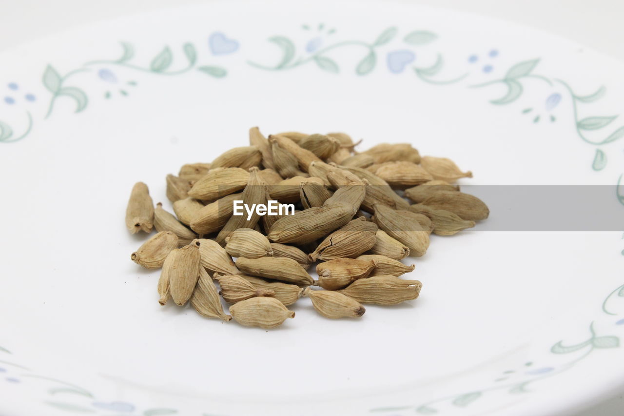 Close-up of cardamoms in plate