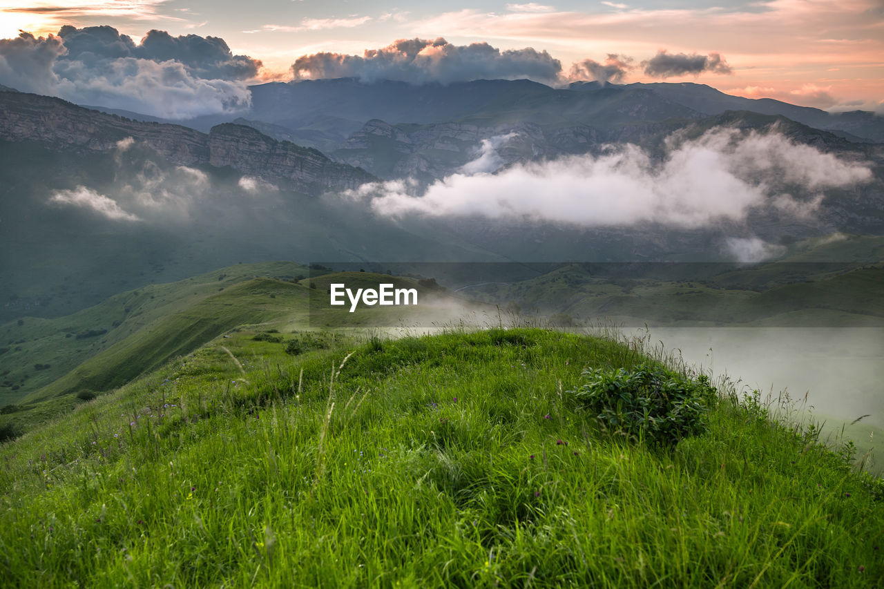Scenic view of landscape against sky during sunset