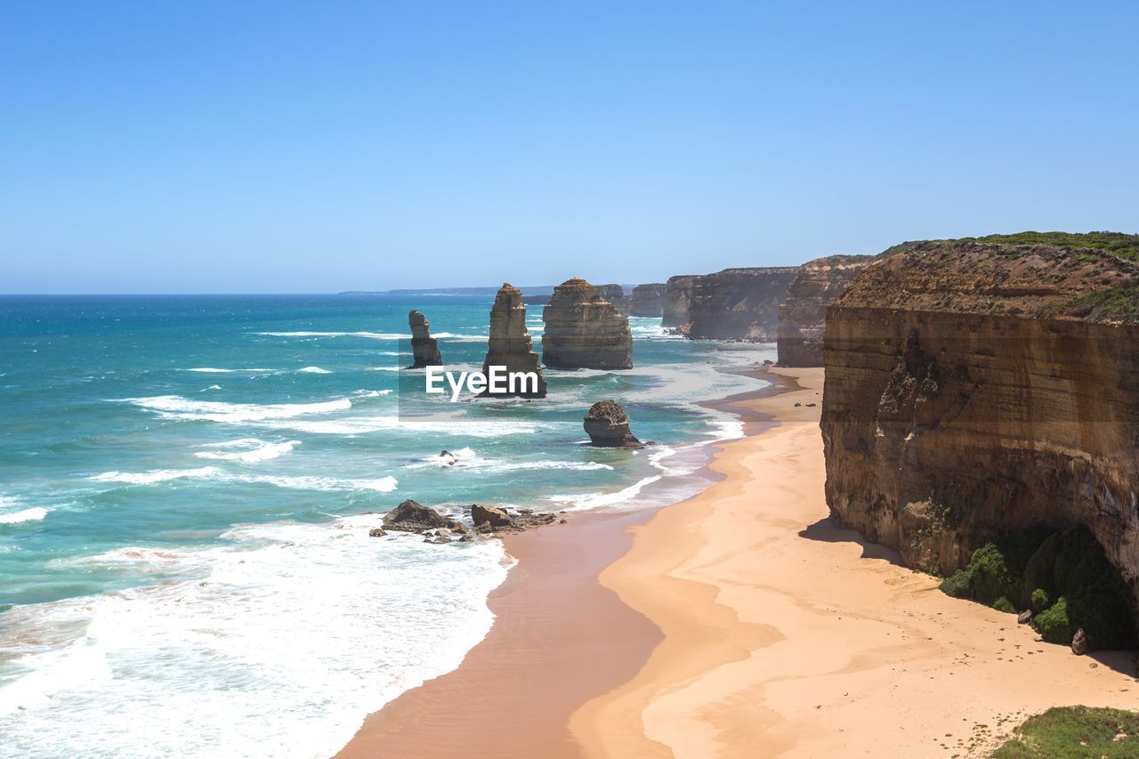 Scenic view of sea against clear blue sky