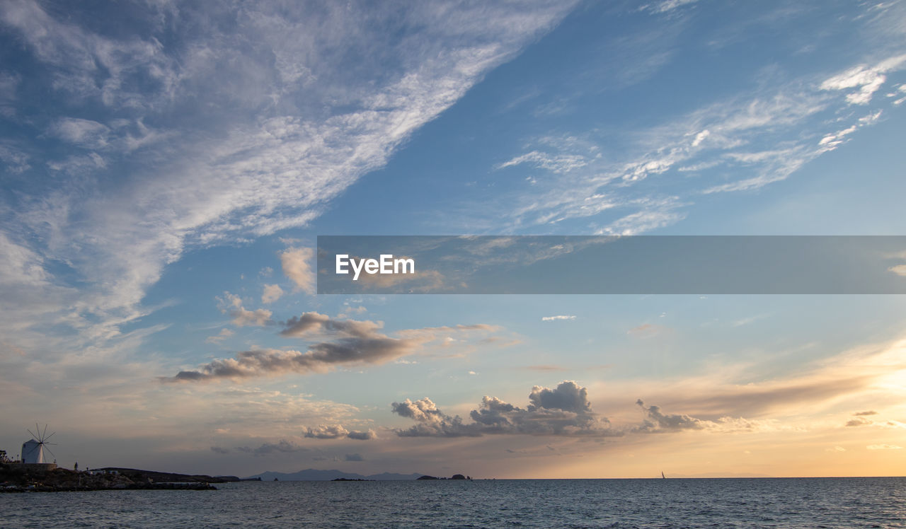 sky, water, sea, cloud, horizon, sunset, beauty in nature, nature, ocean, scenics - nature, dusk, shore, horizon over water, environment, coast, travel, tranquility, land, travel destinations, landscape, seascape, beach, dramatic sky, blue, nautical vessel, evening, outdoors, sunlight, no people, tranquil scene, urban skyline, transportation, cloudscape, body of water, sun, summer, holiday, reflection, tourism, idyllic, wave, bay, vacation, architecture, trip, coastline