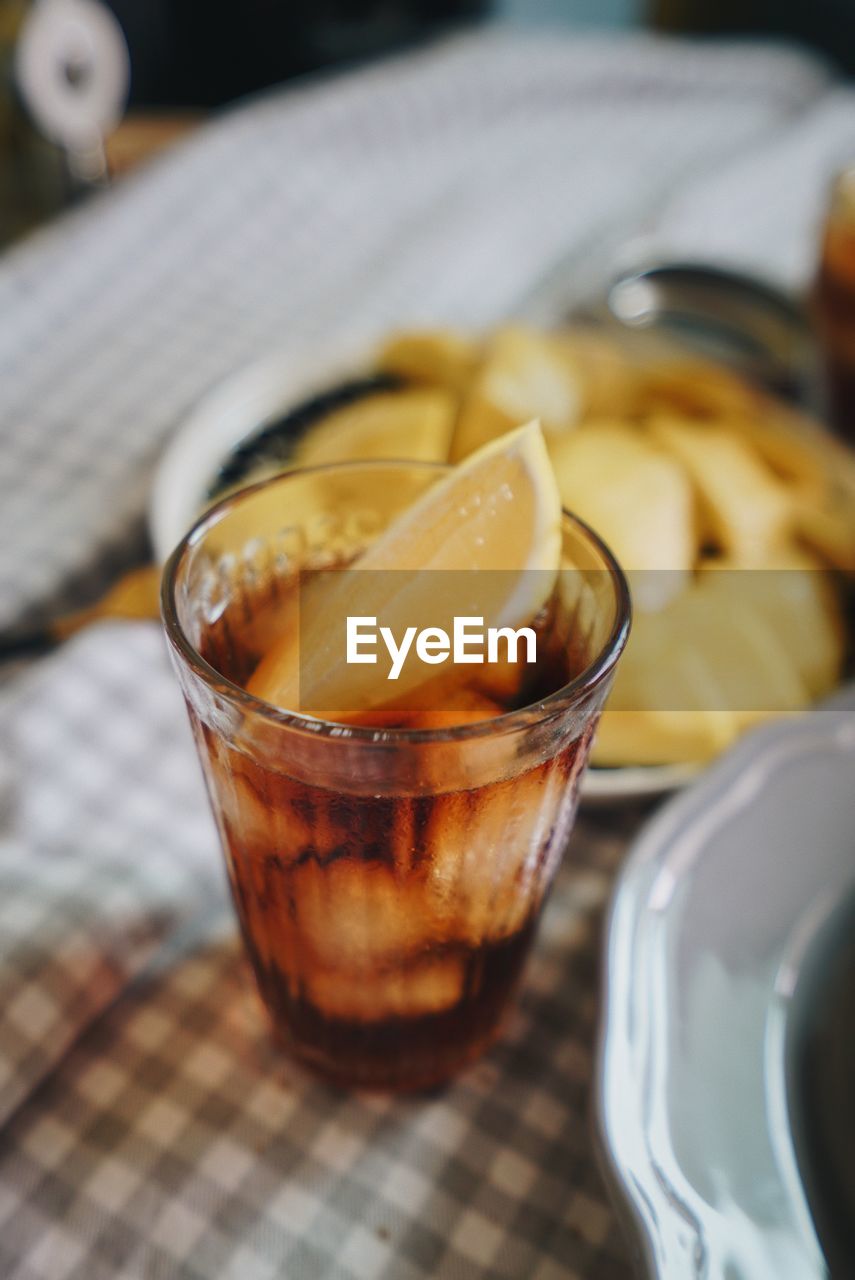 CLOSE-UP OF DRINK IN GLASS