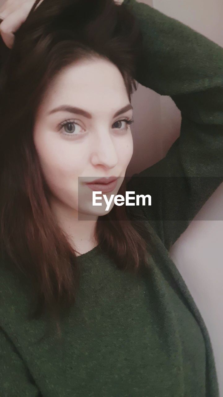 PORTRAIT OF YOUNG WOMAN WITH EYES