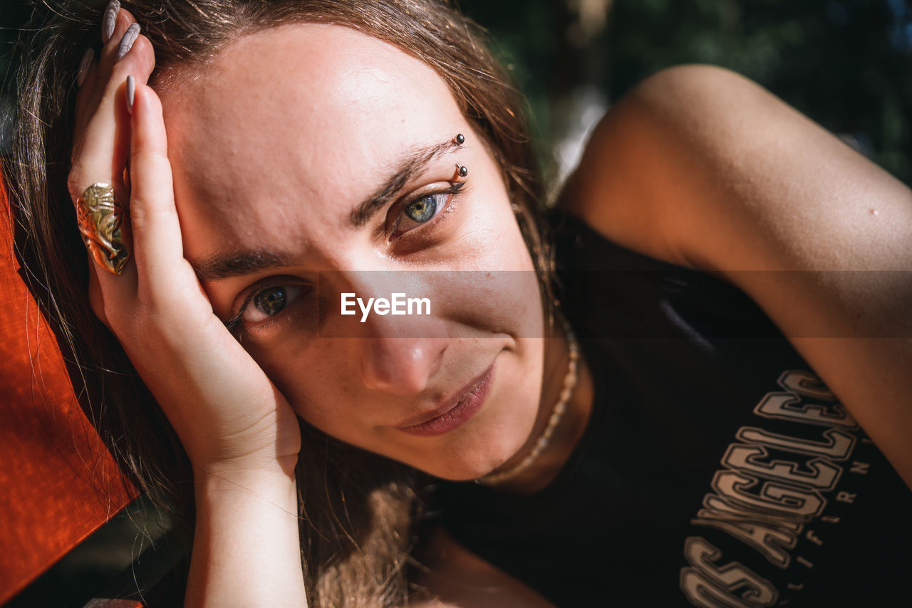 Close-up of young woman looking at the camera 