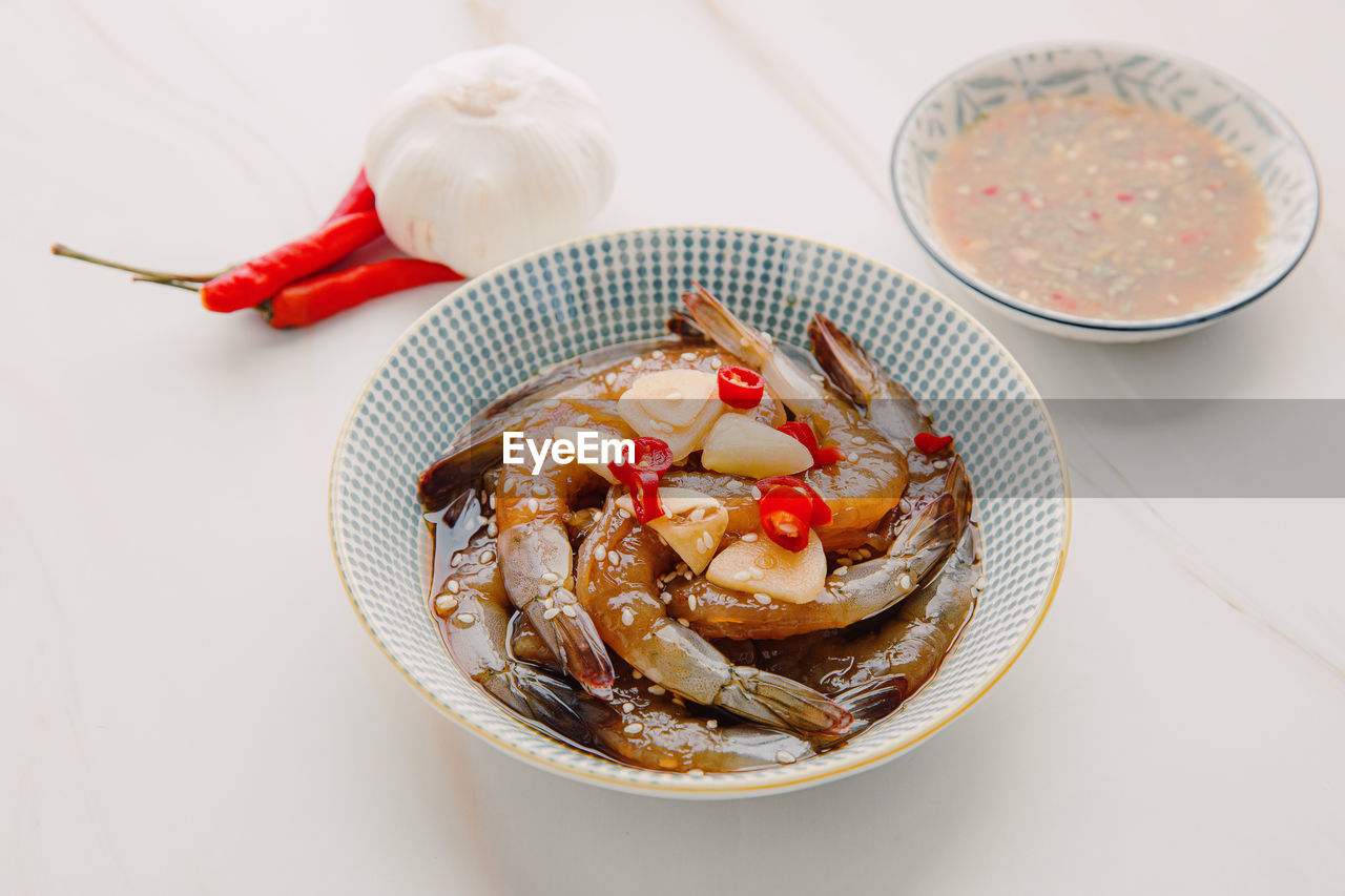 Korean style pickled shrimps saewoo-jang. marinate raw shrimps with chili, garlic and soy sauce