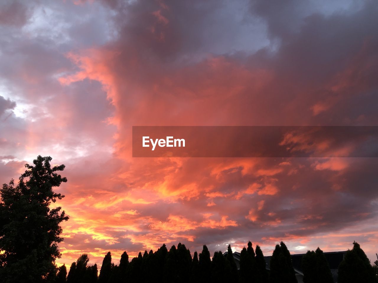 sky, cloud, sunset, beauty in nature, tree, nature, scenics - nature, afterglow, silhouette, landscape, environment, dawn, dramatic sky, red sky at morning, plant, orange color, evening, tranquility, architecture, outdoors, travel destinations, no people, tranquil scene, cloudscape, idyllic, sunlight, land, red, multi colored, travel, sun, mountain, tourism, non-urban scene, forest