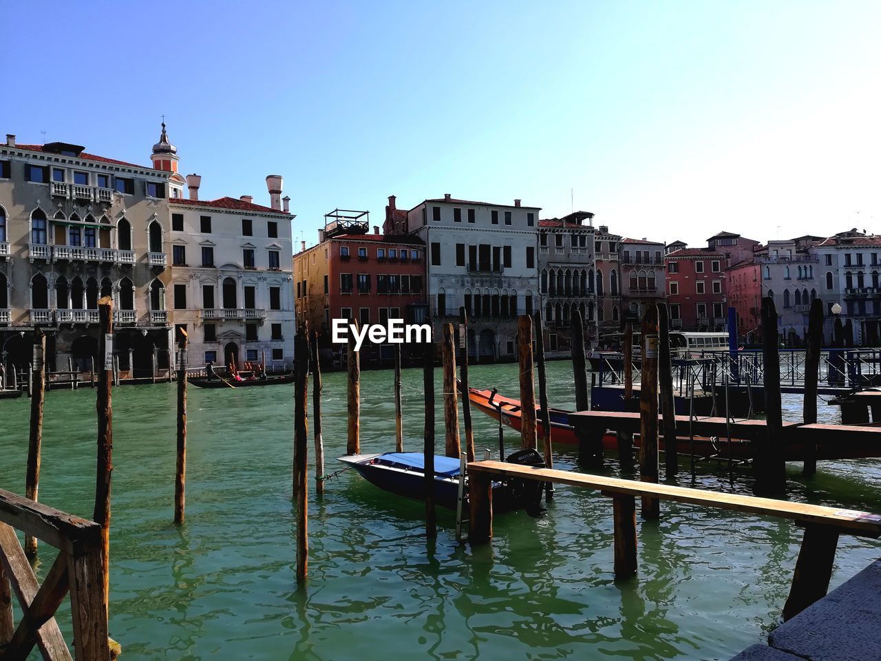 Canal passing through buildings in city