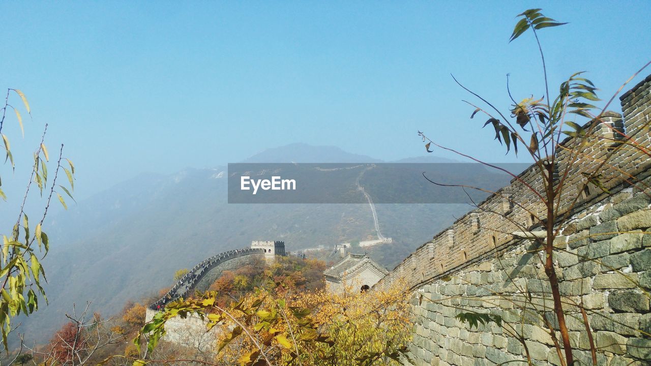 High angle view of trees and mountains against clear sky