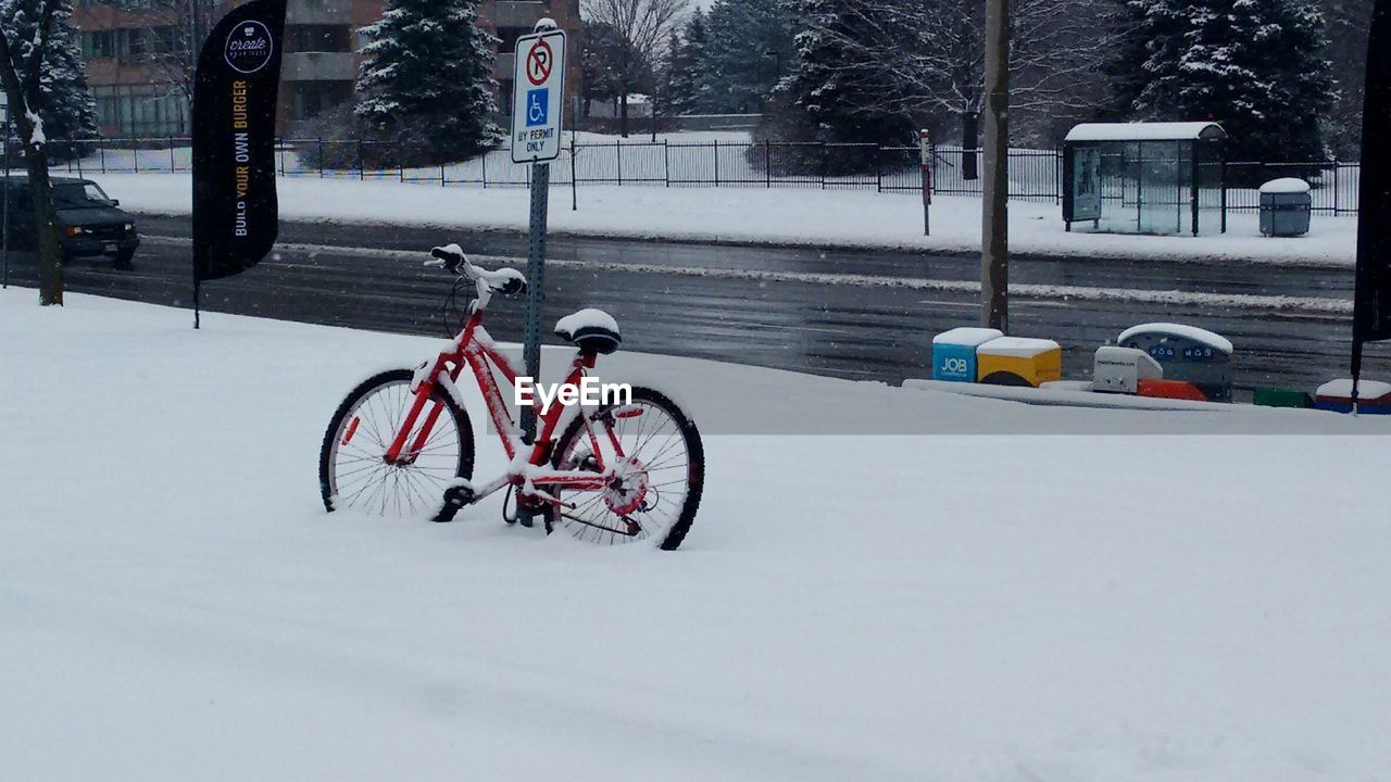 Snowy covered bicycle