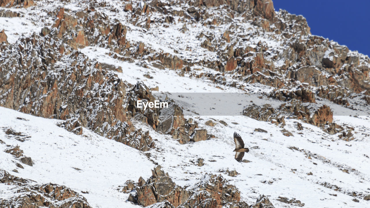 Scenic view of mountain against sky during winter