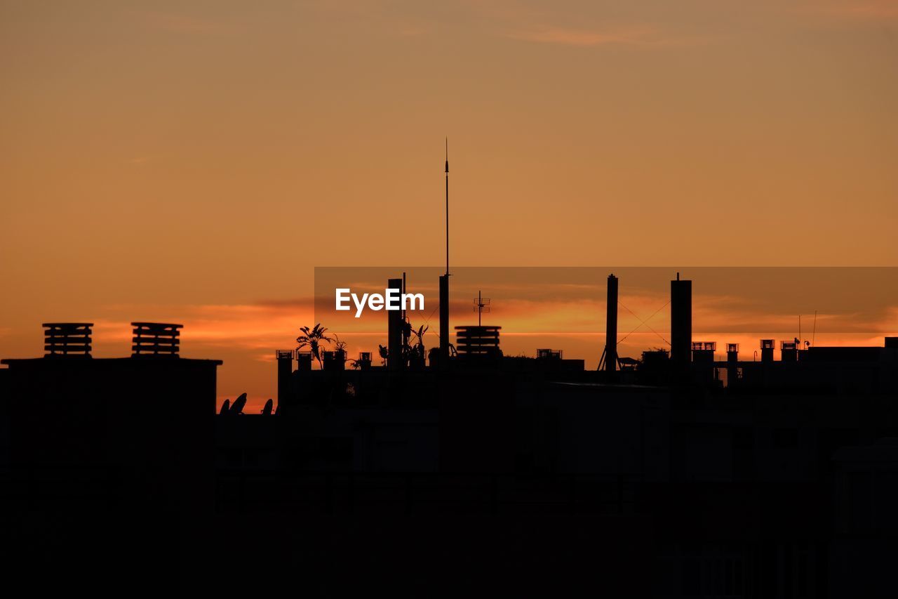 SILHOUETTE OF CITY DURING SUNSET