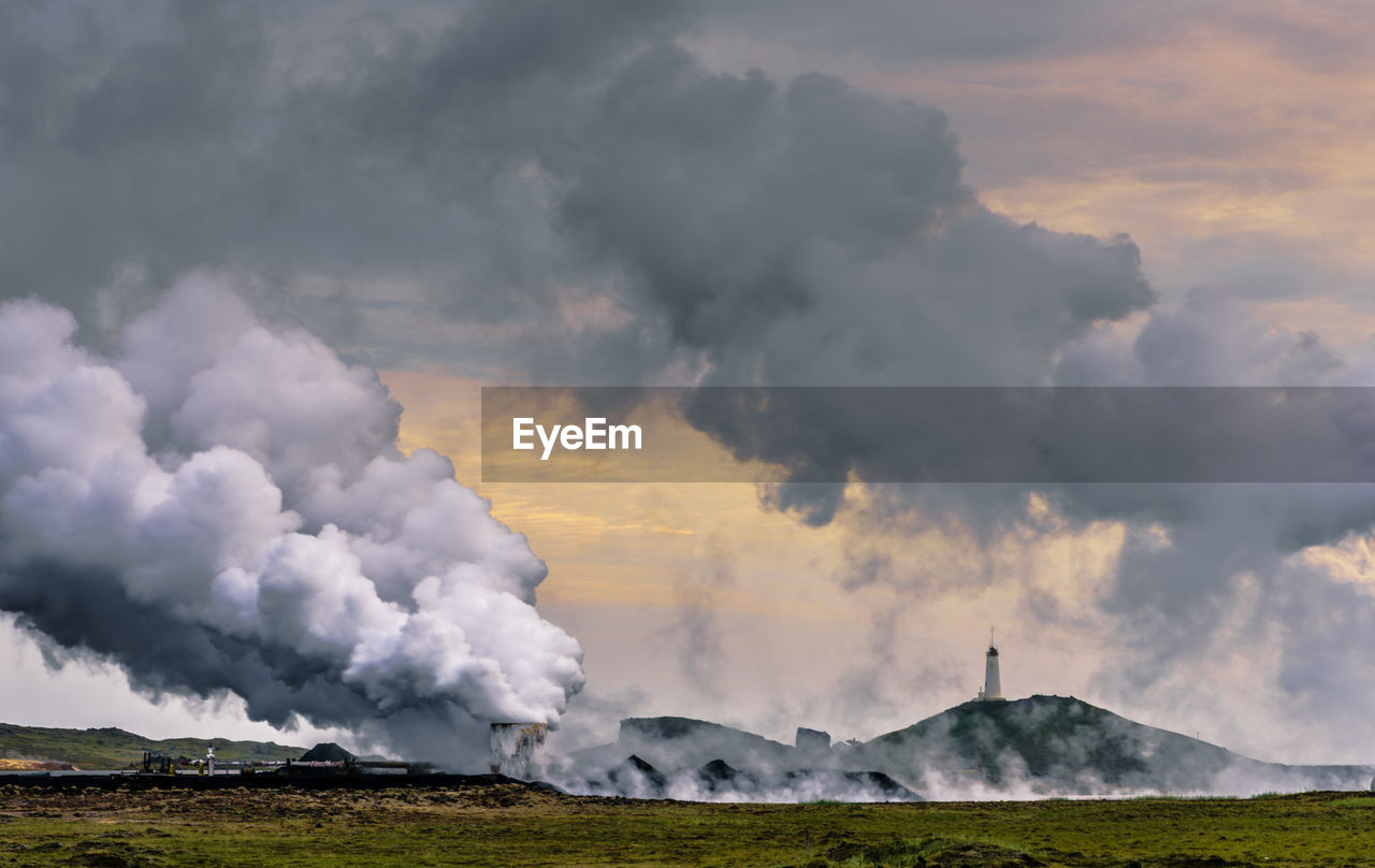 SMOKE EMITTING FROM VOLCANIC LANDSCAPE