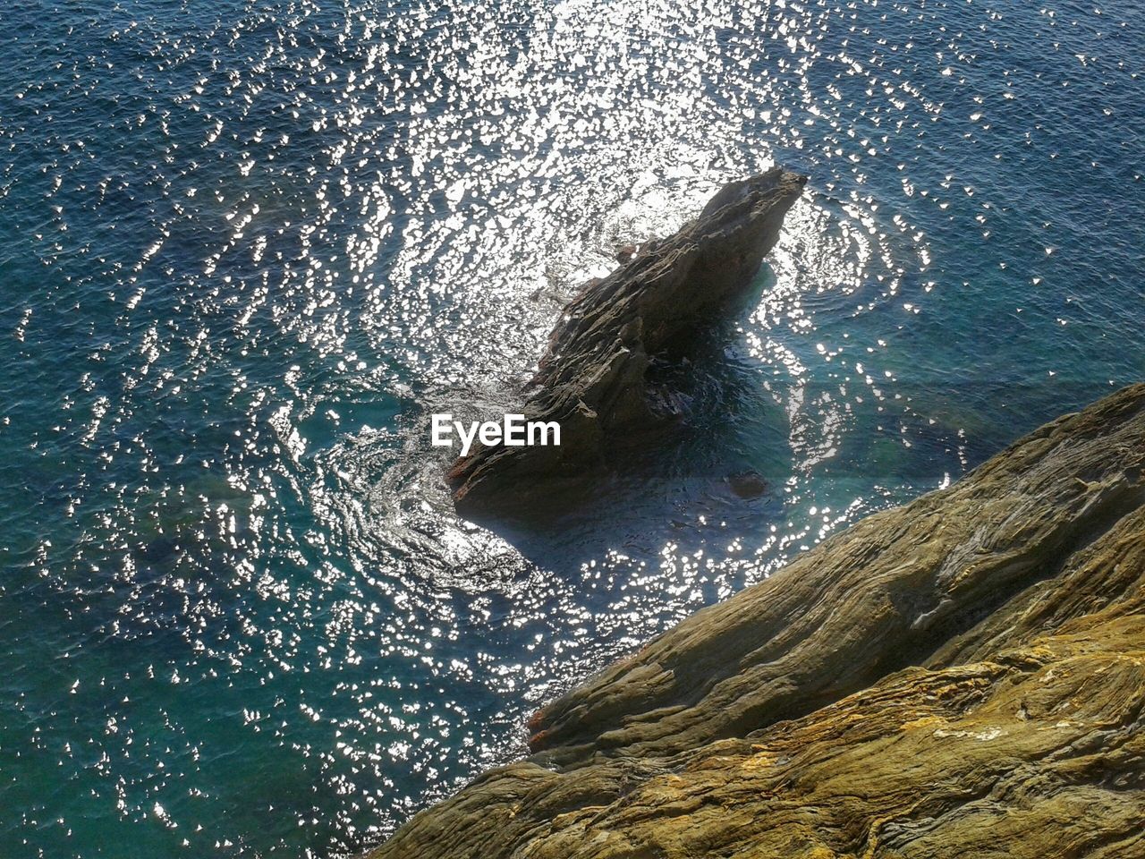 View of a rock at a rocky seashore 