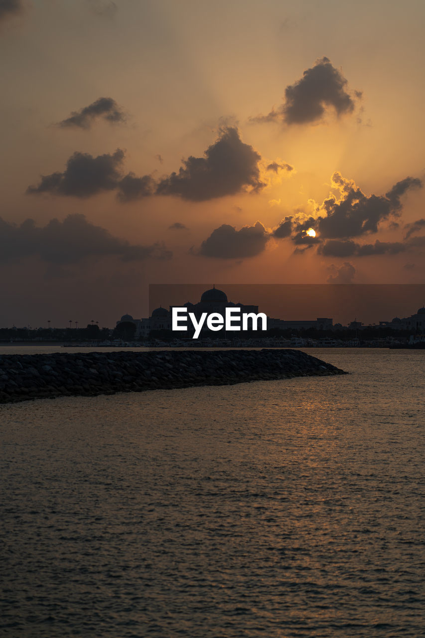 scenic view of sea at sunset