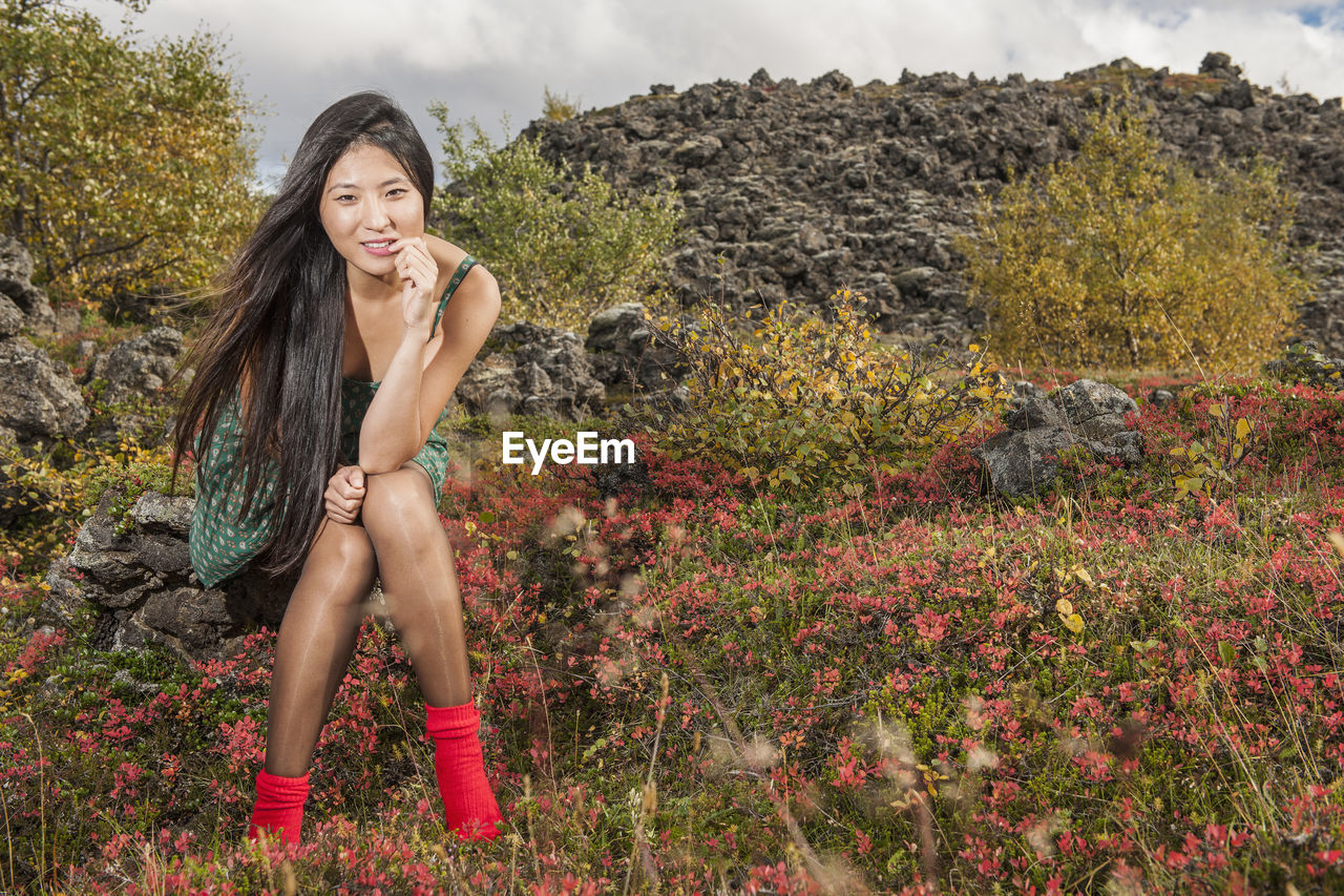 Beautiful woman relaxing at icelandic meadow