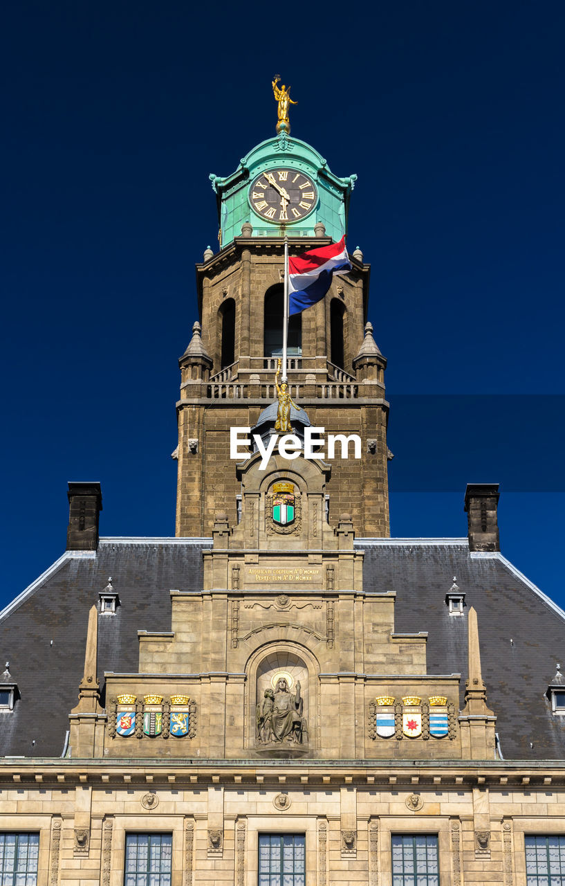 LOW ANGLE VIEW OF CLOCK TOWER AGAINST SKY