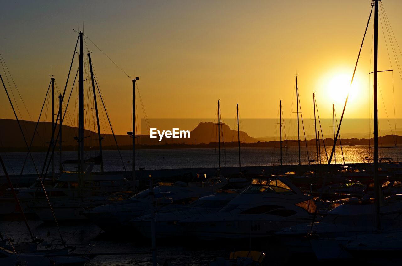 SILHOUETTE OF HARBOR AT SUNSET